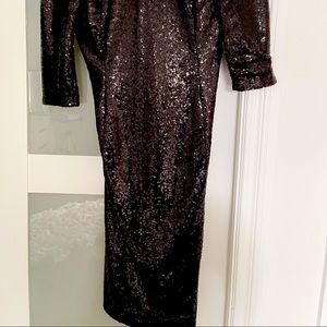 Black sequence dress with quarter sleeves.